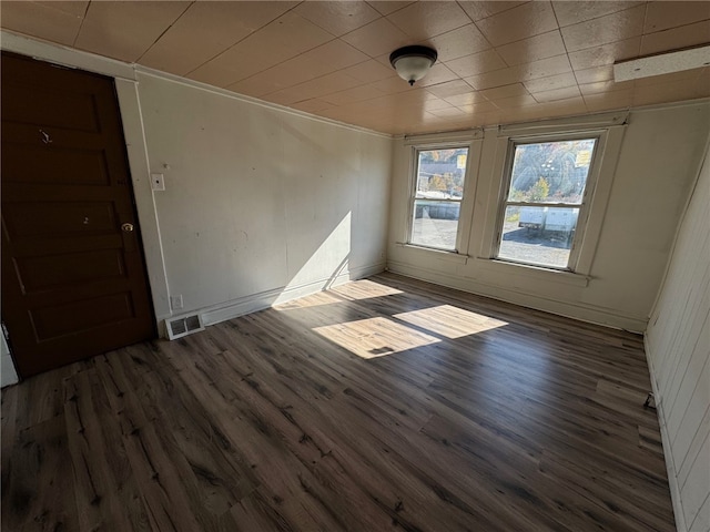 spare room featuring dark hardwood / wood-style flooring