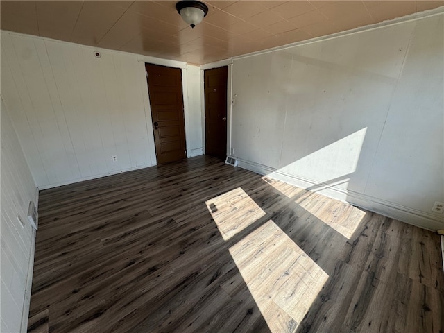 unfurnished room with dark hardwood / wood-style floors