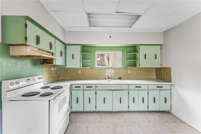 kitchen featuring a drop ceiling, white electric range, and light tile patterned floors