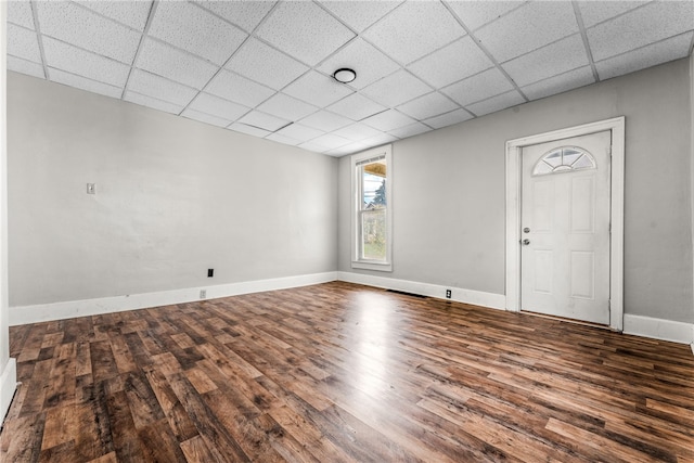 foyer featuring a drop ceiling and dark hardwood / wood-style flooring