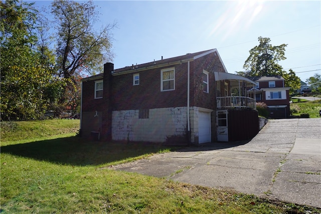 back of property featuring a yard