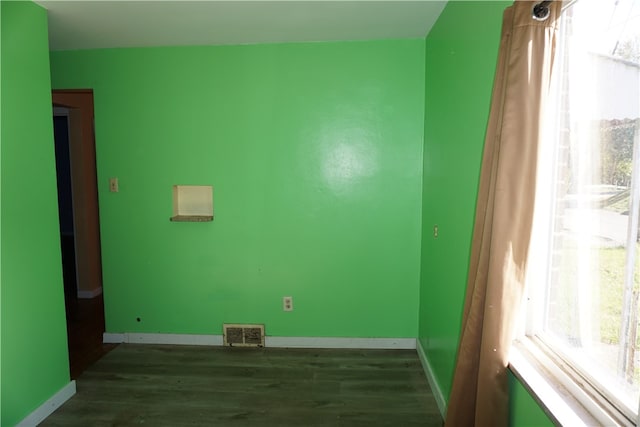 spare room featuring dark hardwood / wood-style flooring