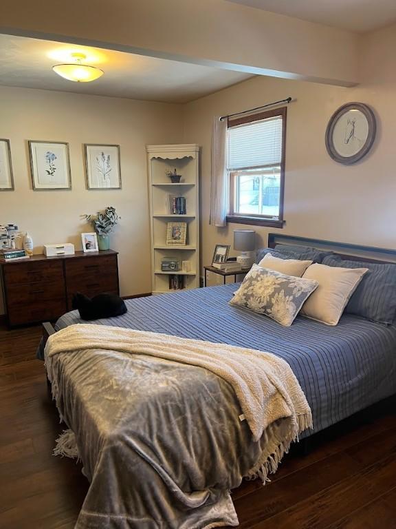 bedroom featuring dark hardwood / wood-style flooring