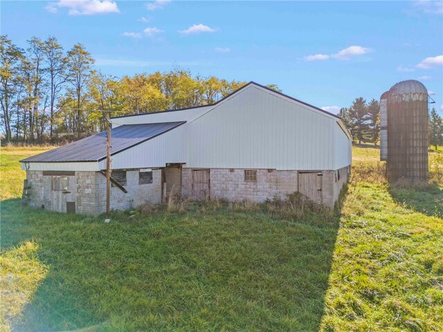 view of outbuilding with a lawn