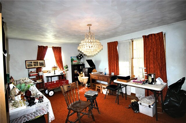 dining space featuring a notable chandelier, carpet floors, and plenty of natural light