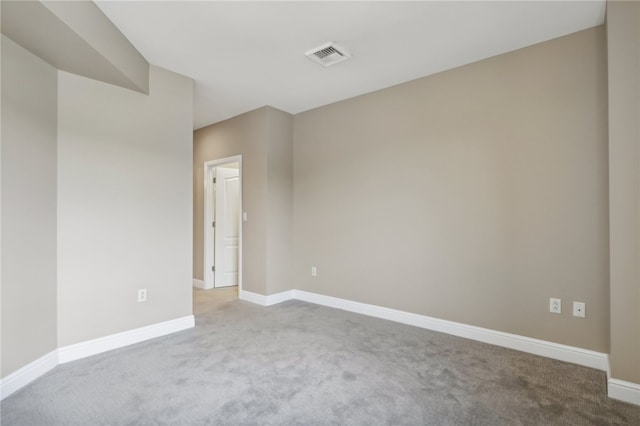 empty room featuring light colored carpet