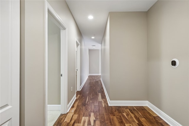 hall with dark hardwood / wood-style floors