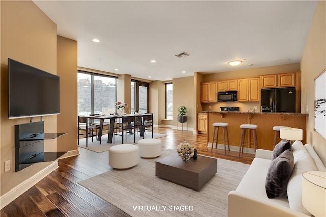 living room with light hardwood / wood-style floors