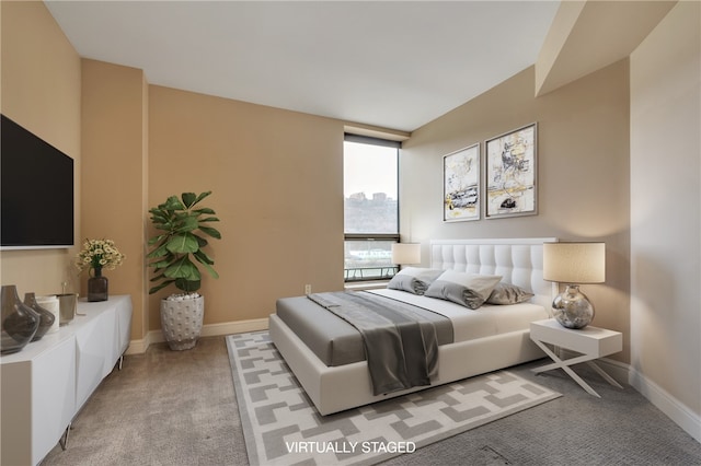 bedroom with light colored carpet