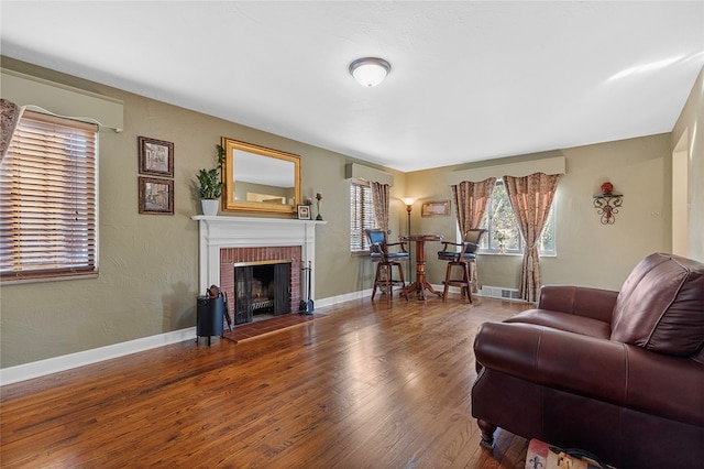 living room featuring a fireplace and hardwood / wood-style floors