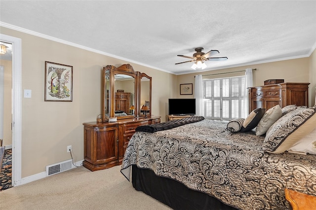 bedroom featuring crown molding, a textured ceiling, light colored carpet, and ceiling fan