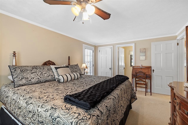 carpeted bedroom featuring ceiling fan and ornamental molding