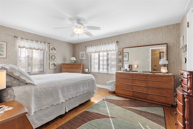 bedroom with hardwood / wood-style flooring and ceiling fan