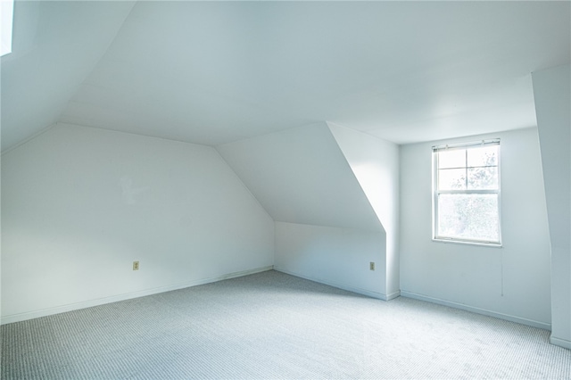 bonus room featuring carpet and lofted ceiling