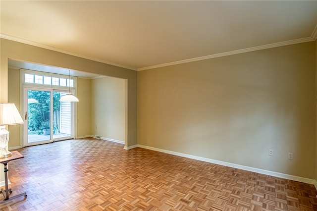 spare room featuring light parquet floors and ornamental molding