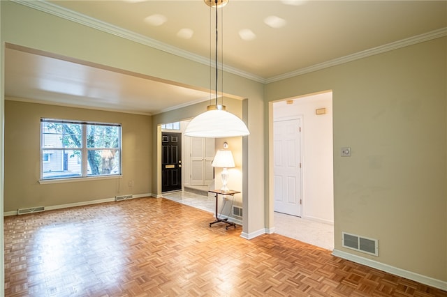 spare room with crown molding and light parquet flooring