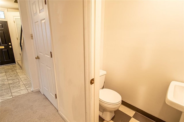 120 S 13th St, South Side, PA 15203 - bathroom featuring a sink, toilet, and baseboards