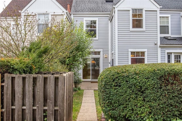 120 S 13th St, South Side, PA 15203 - view of property featuring fence and roof with shingles