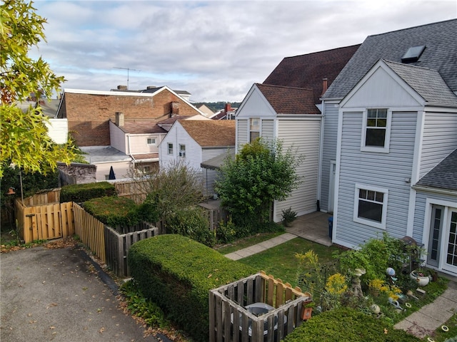 view of side of home featuring a patio area