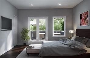 bedroom with dark hardwood / wood-style floors