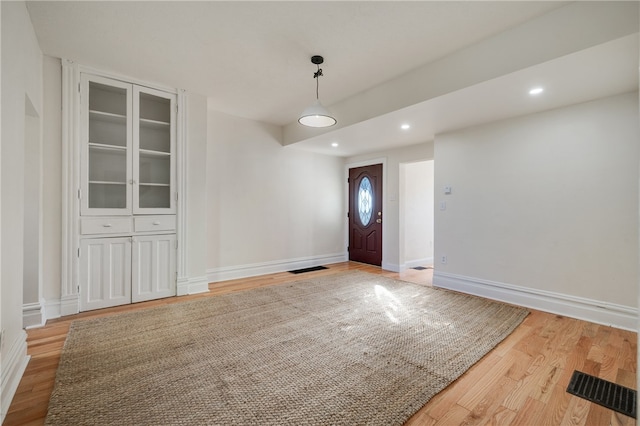 foyer entrance with light wood-type flooring