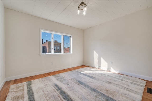 empty room with light hardwood / wood-style floors