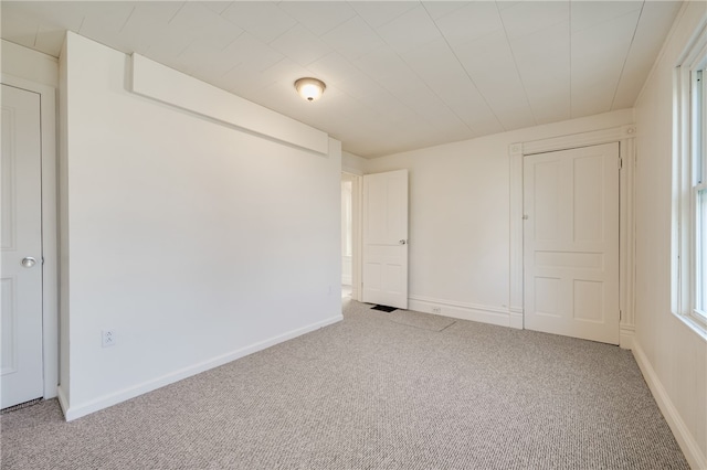 unfurnished bedroom with light carpet