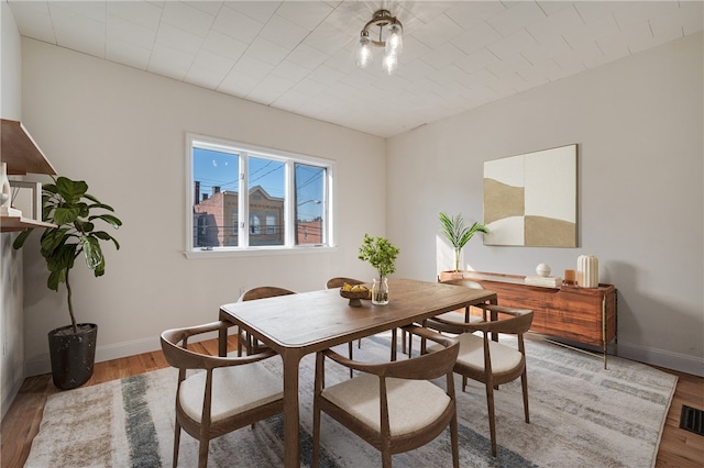 dining area with light hardwood / wood-style floors