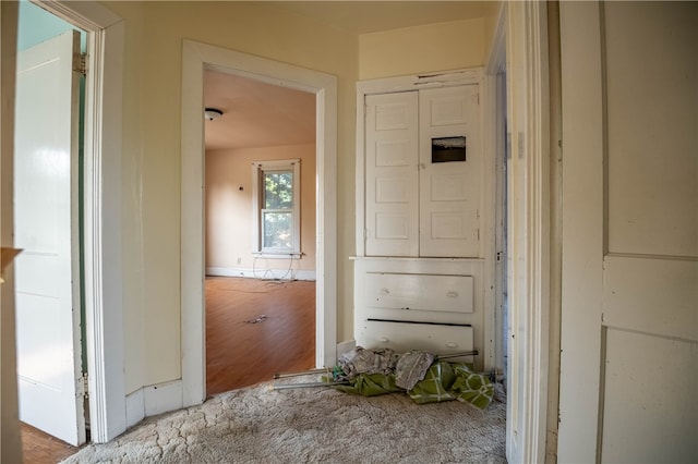 corridor with wood-type flooring