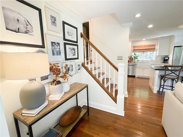 stairway with hardwood / wood-style flooring