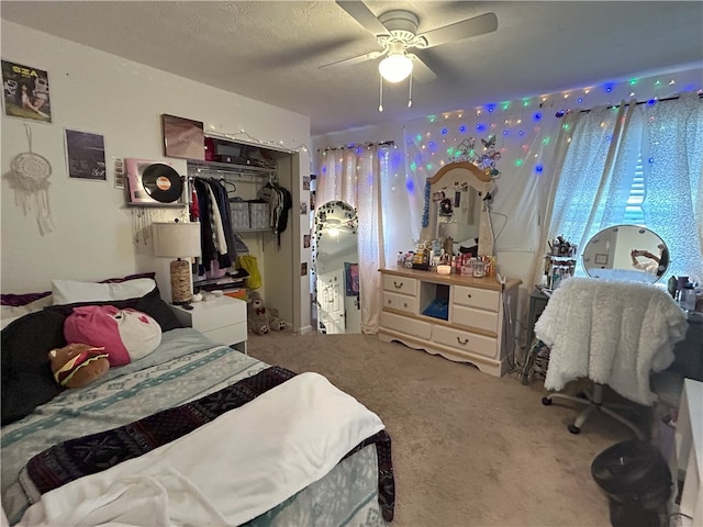 bedroom with ceiling fan, a closet, and carpet floors