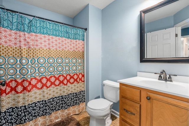 bathroom with toilet, vanity, and a shower with shower curtain