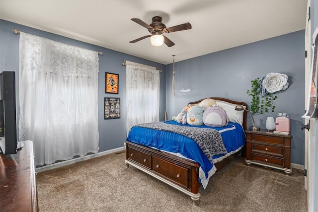 carpeted bedroom with ceiling fan