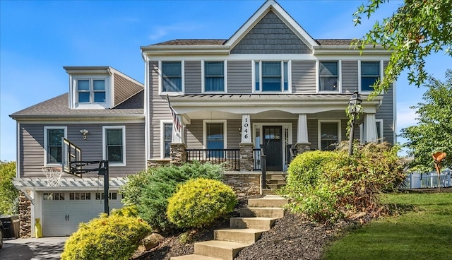 craftsman-style house featuring a garage and a porch