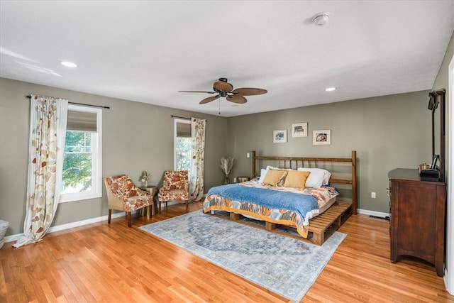 bedroom featuring light wood-type flooring and ceiling fan