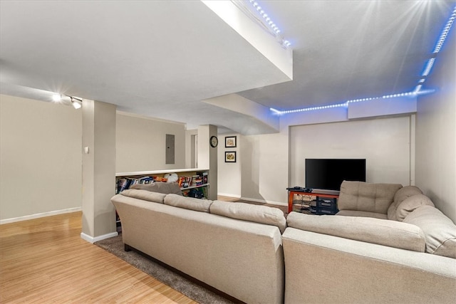 living room featuring electric panel and wood-type flooring