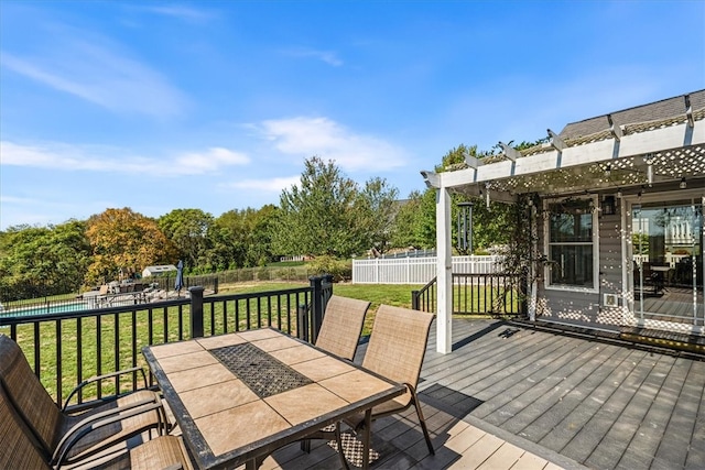 wooden deck with a pergola and a lawn