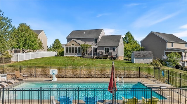 view of pool with a yard