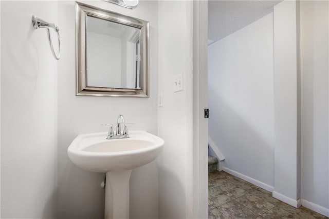 bathroom with sink and tile patterned flooring