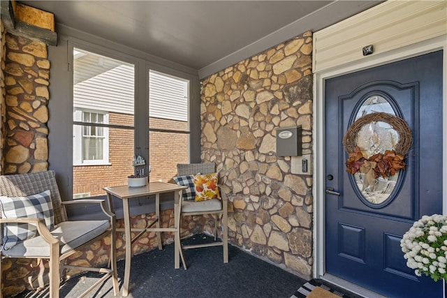 entrance to property featuring covered porch