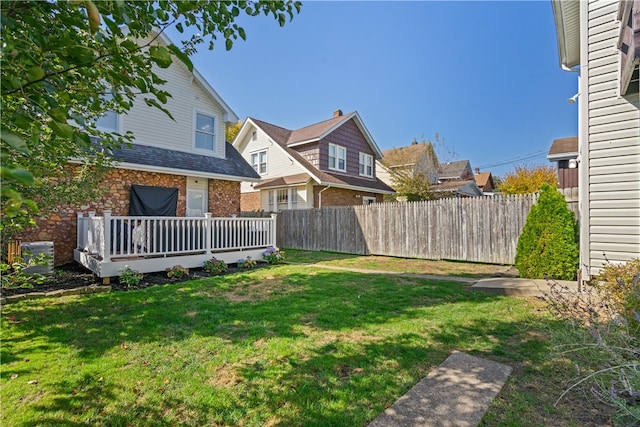 view of yard featuring a wooden deck