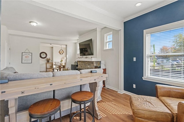 bar with hardwood / wood-style floors, plenty of natural light, and crown molding