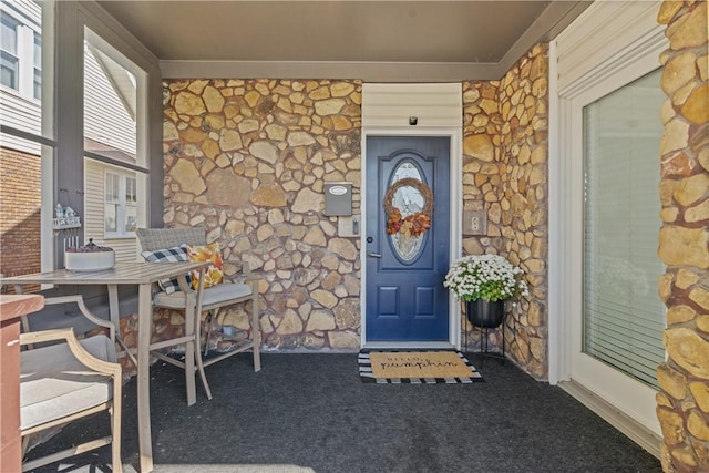 property entrance featuring a porch