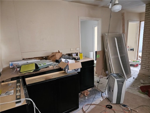 interior space with dark cabinetry