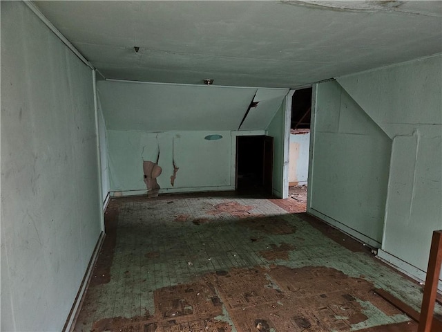 additional living space featuring vaulted ceiling