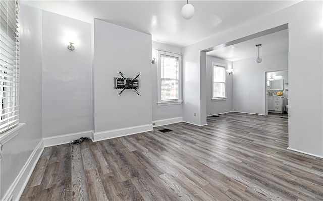 unfurnished room featuring dark hardwood / wood-style floors