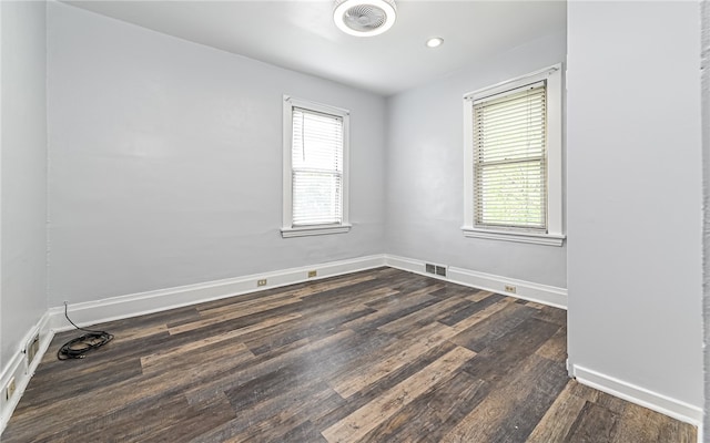 unfurnished room featuring dark hardwood / wood-style floors