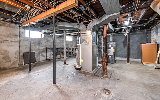 basement featuring gas water heater and heating unit