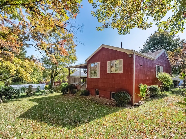 view of home's exterior with a lawn