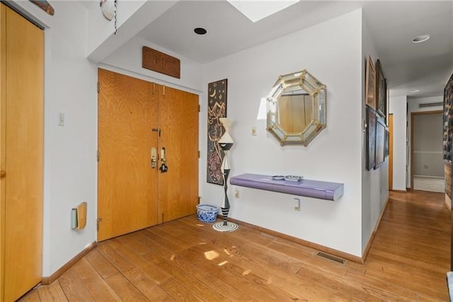 foyer with light hardwood / wood-style flooring